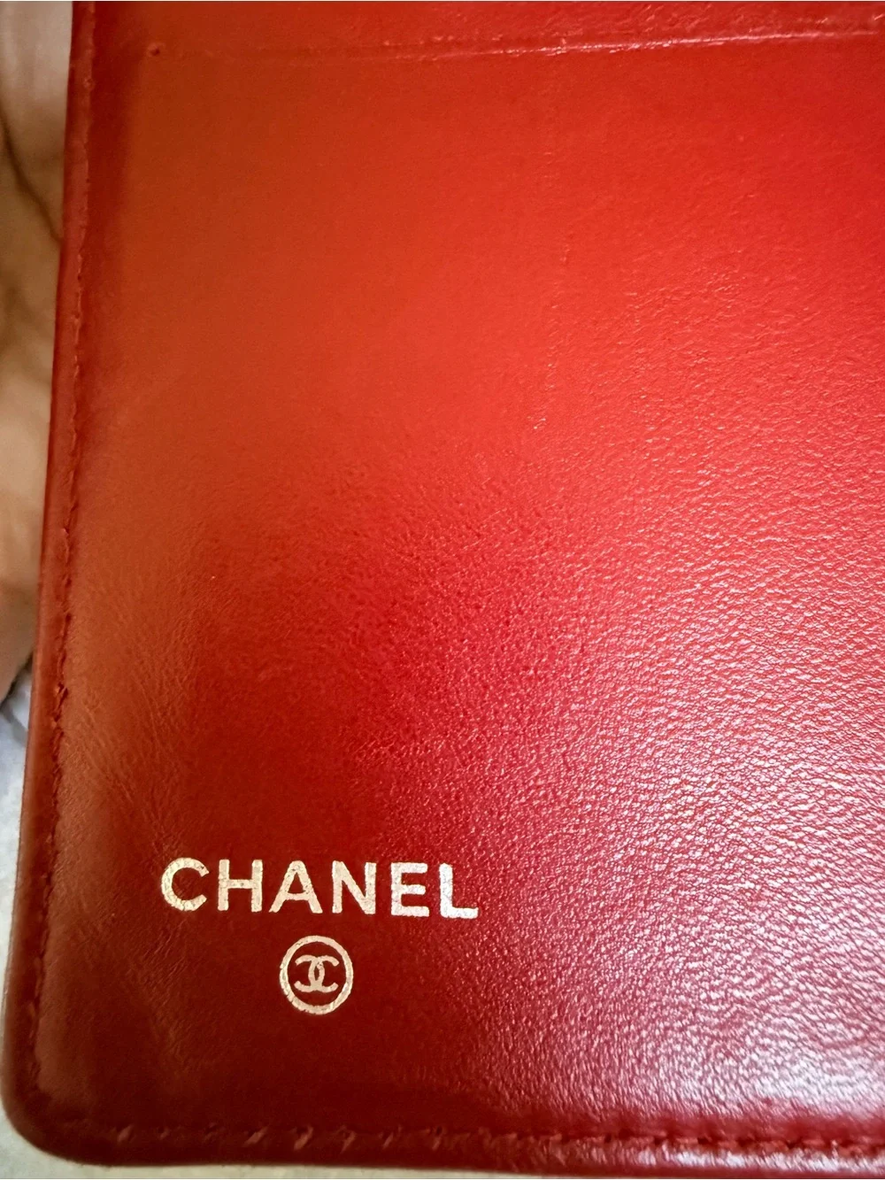 Authentic CHANEL Quilted Red Lambskin Leather Long Wallet with Silver CC Emblem.